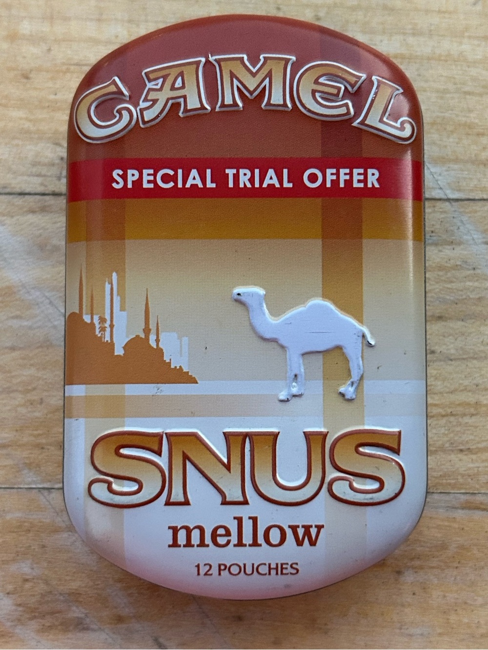 collectible metal tin Camel SNUS Mellow embossed camel logo desert scene.